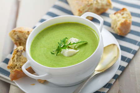 Delicious broccoli cream soup with rye bread . International cuisine meal.の写真素材