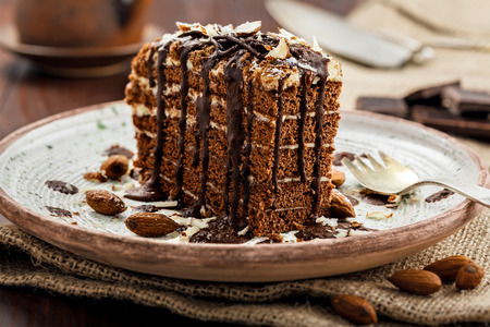 Delicious sweet chocolate Spartak cake on a rustic plate. Haute cuisine dessert. International food. Close-up shot.の写真素材