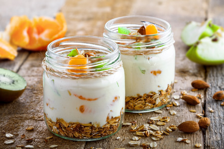 Delicious healthy American breakfast made of granola, yogurt and fruits. Classic US morning meal. Traditional healthy snack. Close-up shot.の写真素材