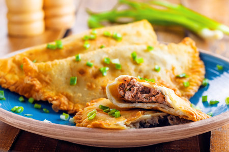 Chebureki on a plate. National Ukrainian, Russian, Turkish, Romanian and Tatar food. Meat pastry...