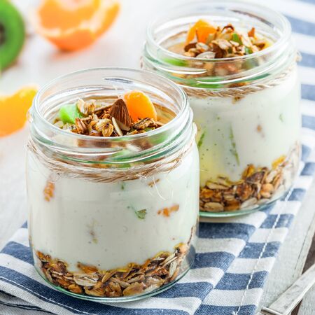 Healthy meal made of granola, yogurt and fruits. Delicious food for breakfast. Traditional American snack.の写真素材