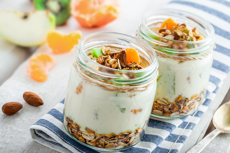 Delicious healthy American breakfast made of granola, yogurt and fruits. Classic US morning meal. Traditional healthy snack.の写真素材