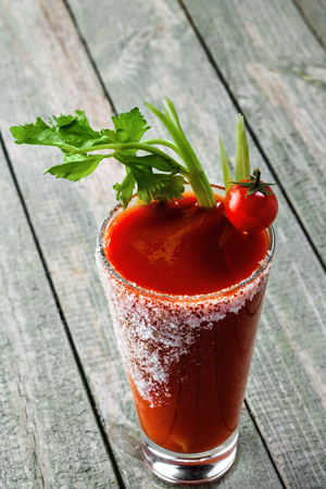 Bloody mary cocktail made of tomato juice, vodka, pepper, salt, lemon juice, celery and other flavorings. Classic alcoholic drink mix.の写真素材