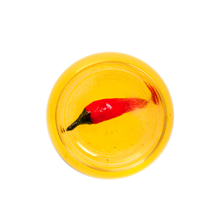 Delicious alcoholic cocktail shot in a short glass made of peach liqueur, lemon fresh and tequila isolated on white background. Top view.の写真素材
