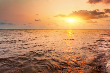 Sunset sky above sea, summer landscapeの写真素材