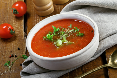 Gazpacho and ingredients on a table, vegetable soup. Delicious Spanish vegan cuisine.の写真素材