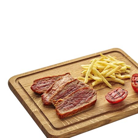 Steak with French fries, grilled cherry tomatoes and sauce isolated on white background. Wholesome American lunch served on a cutting board. Studio shot, close-up.の写真素材
