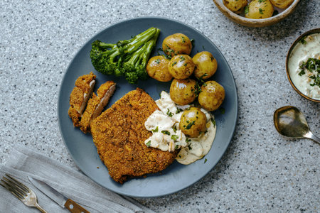 Traditional Schnitzel Dinner with Baby Potatoes. Top View Shot.の写真素材