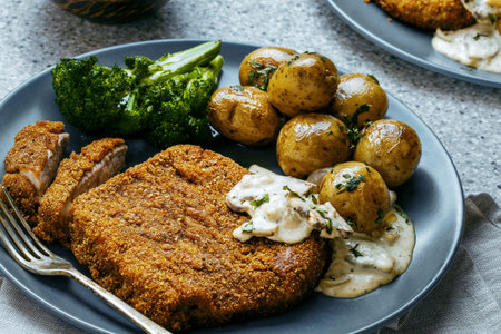 Breaded Schnitzel with Potatoes and Broccoli. Top View Flat Lay Shot.の写真素材