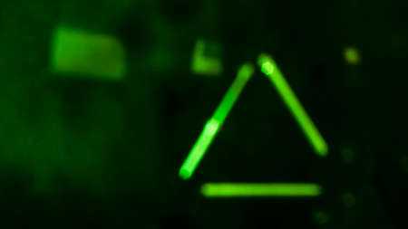 green futuristic lines and shapes on black backgroundの写真素材