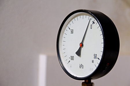 Photo shows industry meter with numbers and white background.