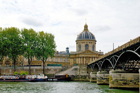Photo shows various Parisian (France) houses, river and boats.
