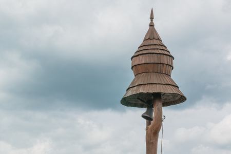 This photo shows an old wooden dovecote in the village.の写真素材