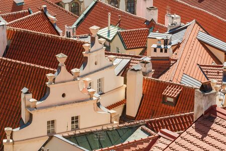Photo shows Prague cityscape view with various buildings, towers and monuments during a day.の写真素材