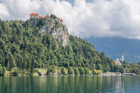 Photo shows a landscape of lake Bled, Slovenia in summer.