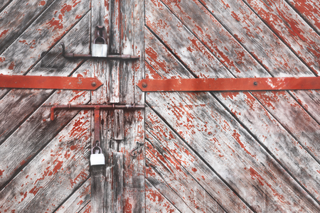 The old door locked with a padlock hanging brackets. Set of backgrounds. Ukraineの写真素材