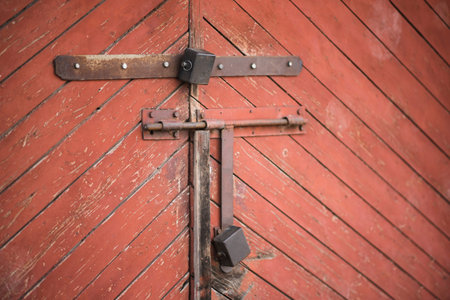 The old door locked with a padlock hanging brackets. Set of backgrounds. Ukraine
