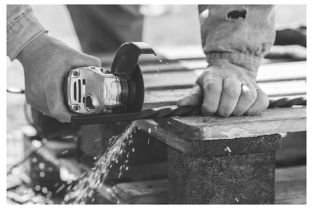 The process of cutting metal using the angle grinder. Ukraineの写真素材