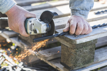 The process of cutting metal using the angle grinder.の写真素材