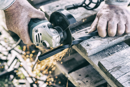 The process of cutting metal using the angle grinder. Ukraineの写真素材