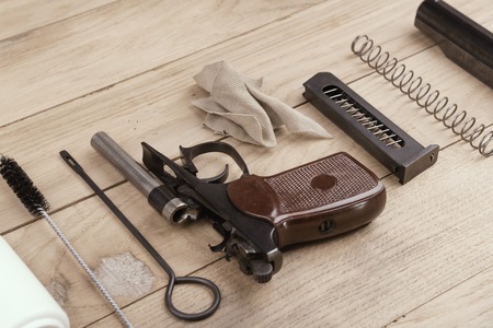 Separate parts of Makarov pistol and cleaning kitの写真素材