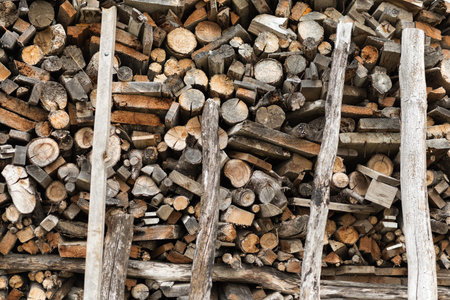A pile of stacked firewood. Preparation for winter season.