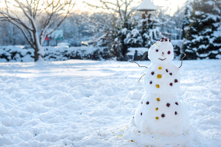 Snowman in the middle of the yard, children's entertainments, winter fun, Ukraine