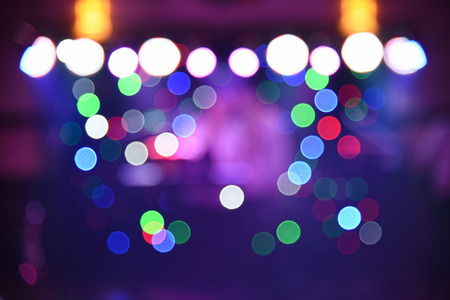 Blurry colorful background, light at a dance party, designer background for text overlayの写真素材