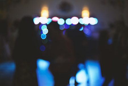 Blurry colorful background, light at a dance party, designer background for text overlayの写真素材