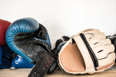 Worn boxing and kickboxing accessories: gloves, focus punch pad, sports lifestyle