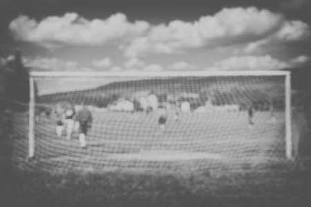 Abstract defocused background about soccer theme with copy space for text, retro toning