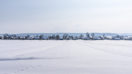 Winter landscape, view of village from afar, Western Ukraine. Banner 16x9 formatの写真素材