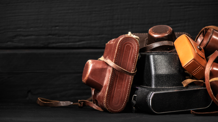 Retro cameras in leather covers. Collection of old things and antiques, auctionsの写真素材