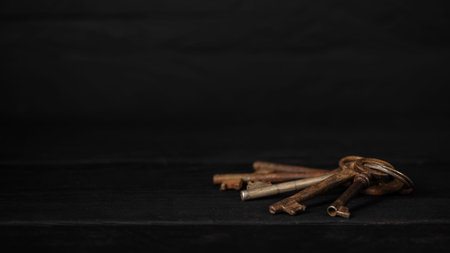 Bunch of old metal keys on a table, low key. Theme of collecting and vintage decoration, safety...