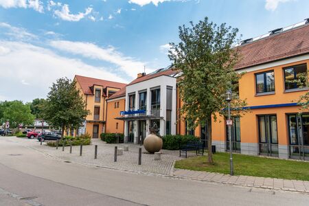 Donaustauf, Bavaria, Germany - July 27, 2018: The facade of Raiffeisenbank. View on the other side of the road.のeditorial素材