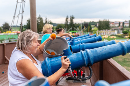 Loifling, Germany - 26 July, 2018: Women are having fun on Pirates of the Caribbean attraction in Churpfalzpark Loifling. Outdoor activitiesのeditorial素材