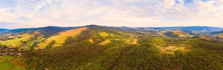 180 degrees panoramic landscape of countryside, aerial drone view of nature in Carpathians. Sunset time, end of summer.の写真素材