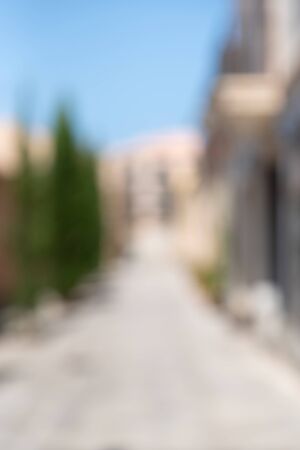 Abstract blur background of urban city in summer day, vertical. Deserted street.の写真素材