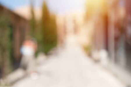 Defocused abstract background of urban city in sunny day, vertical. Deserted street.の写真素材