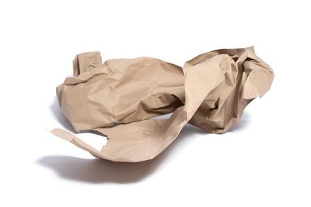 Torn piece of packing paper on white background with shadows.の写真素材
