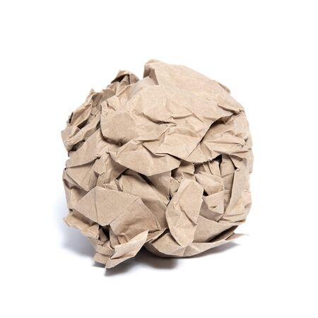 Roll of torn paper in the shape of a ball on white background with shadows. Packing paper.の写真素材