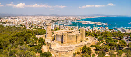 Aerial drone view of Palma de Mallorca city. Cityscape with view on Bellver castle, sea, marina, architecture. Majorca, Balearic Islands, Spainのeditorial素材