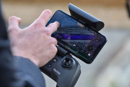 10 April 2022 - Krakow, Poland: Pilot remotely controls the Drone with a thermal sensor. Parrot ANAFI Thermal.のeditorial素材