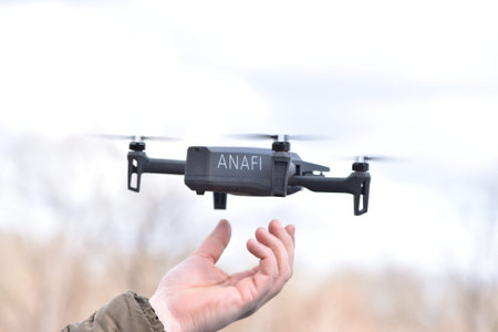 10 April 2022 - Krakow, Poland: Man man catches Drone Parrot ANAFI Thermal in his hand after the...