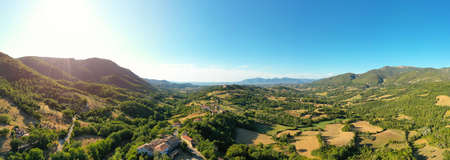 180 degrees scenic panoramic natural landscape. Countryside of Italy, Europe. Aerial Drone view.の写真素材