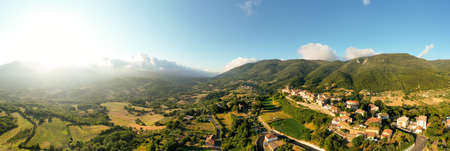 180 degrees scenic panoramic natural landscape. Countryside of Italy, Europe. Aerial Drone view.の写真素材