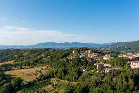 Aerial Drone view of scenic natural landscape with overlooking of architecture. The countryside in Italy. Traveling in Europe.の写真素材