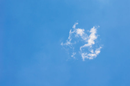 Cloud similar to two childs playing ball in the sky の写真素材