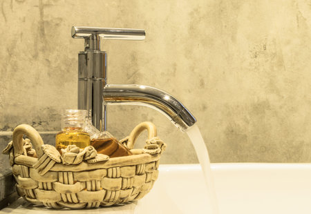 Water from faucet in bathroom boutique style の写真素材