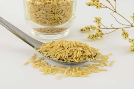 Thai brown rice on spoon.の写真素材